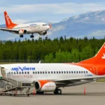 AirNorth aircraft landing and an AirNorth aircraft taxing.