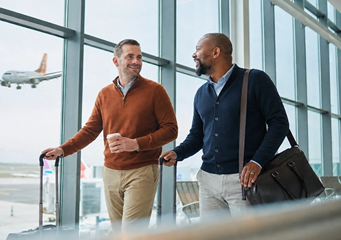 business travellers at airport walking to gate