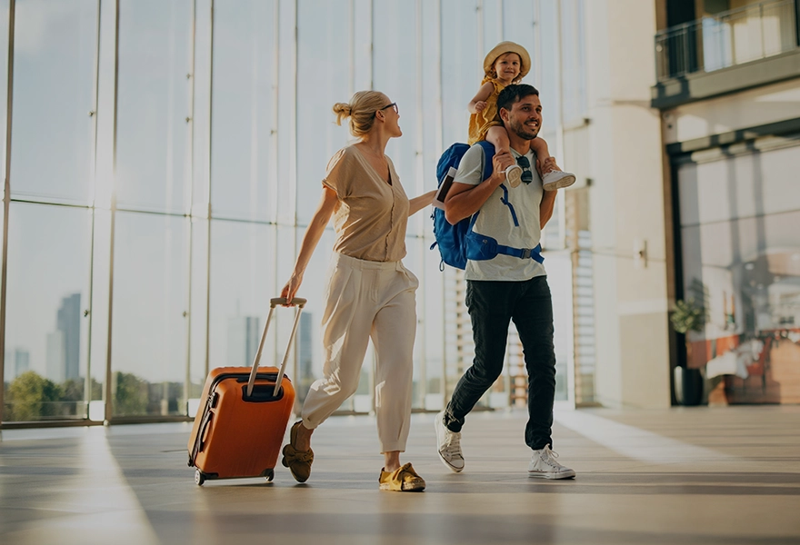family at airport travelling