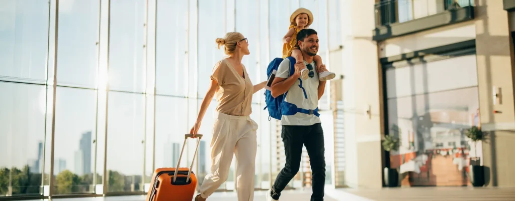 family on a getaway at the airport travelling